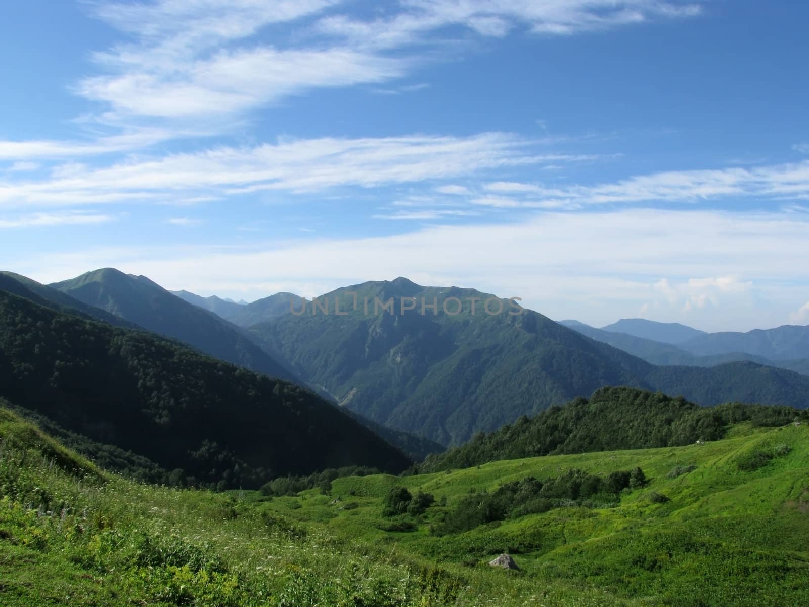 Mountains, rocks; a relief; a landscape; a hill; a panorama; Caucasus; top; a slope; clouds; the sky; a landscape