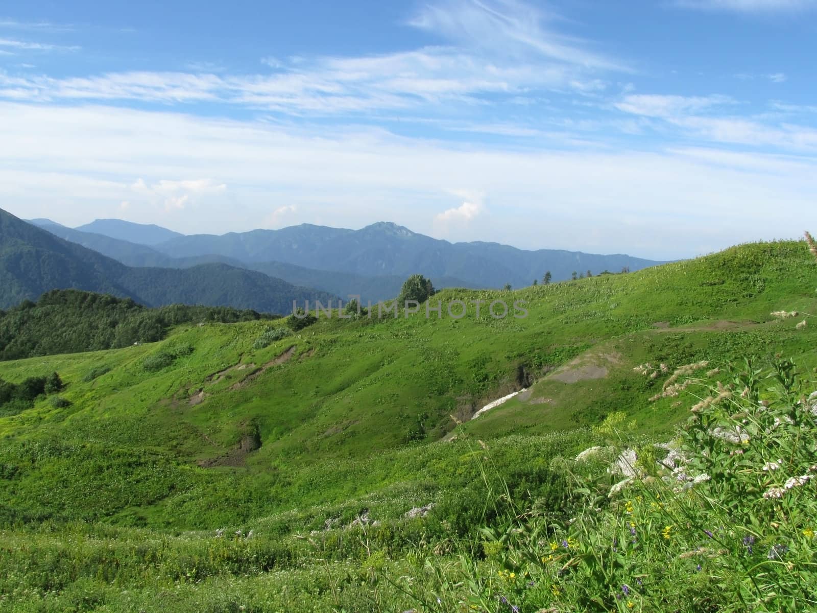 Mountains, rocks; a relief; a landscape; a hill; a panorama; Caucasus; top; a slope; clouds; the sky; a landscape