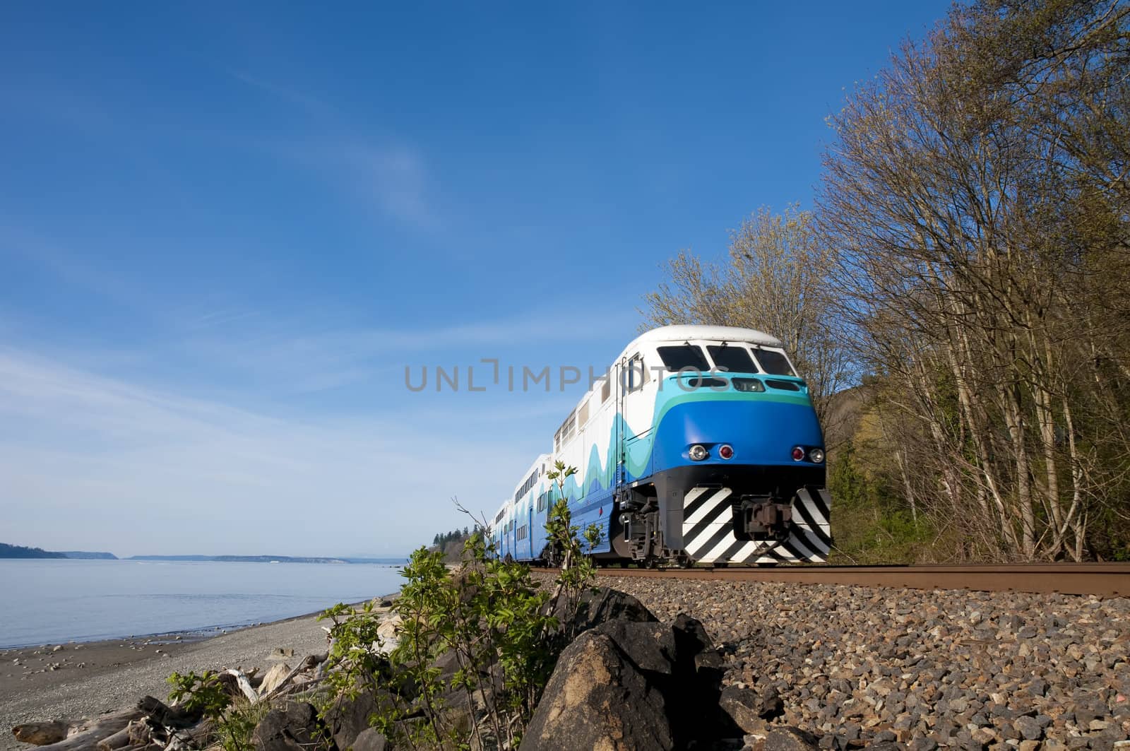 High-speed passenger train on a background of blue sky. by lobzik