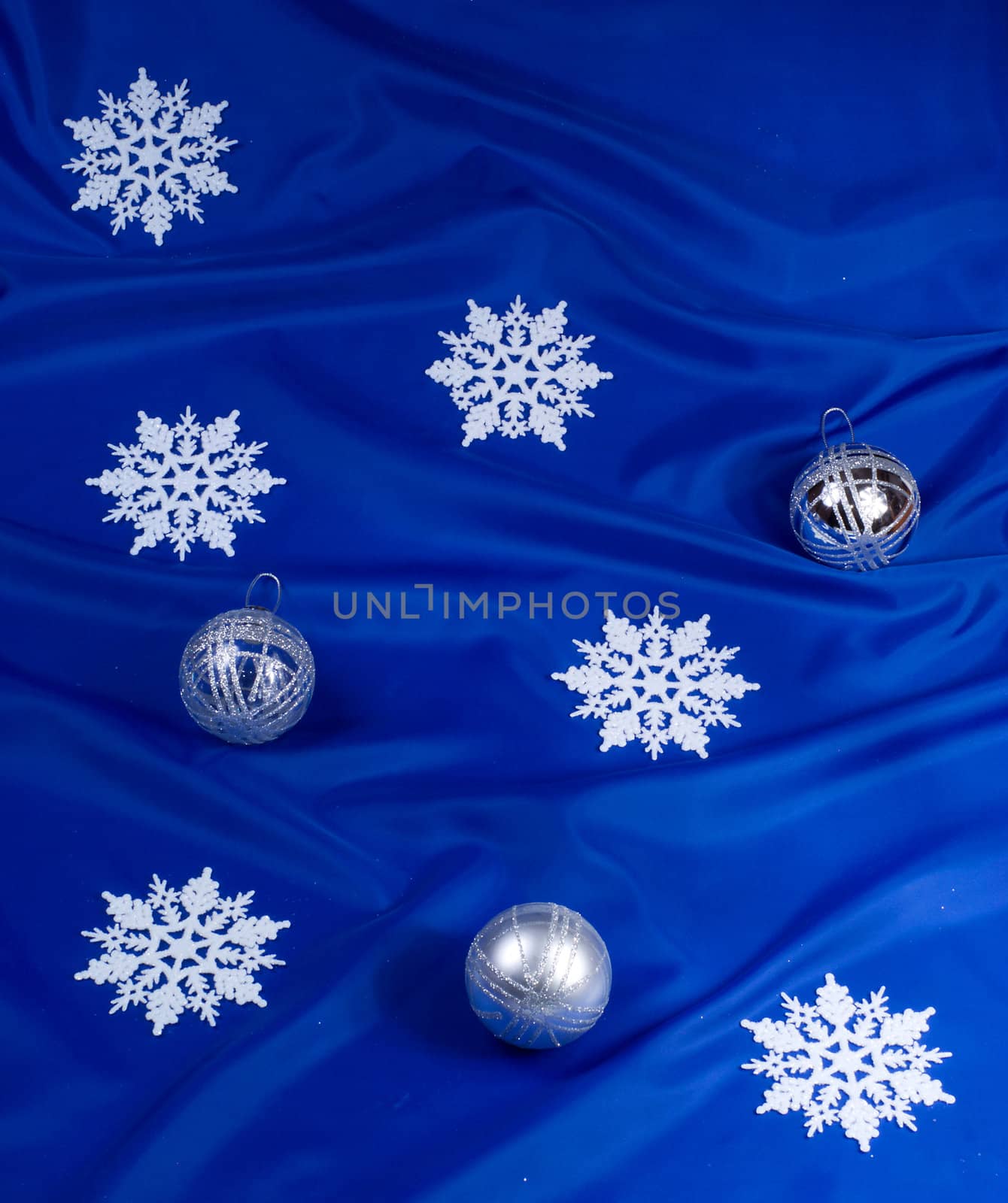 Snowflakes and spheres on a dark blue background