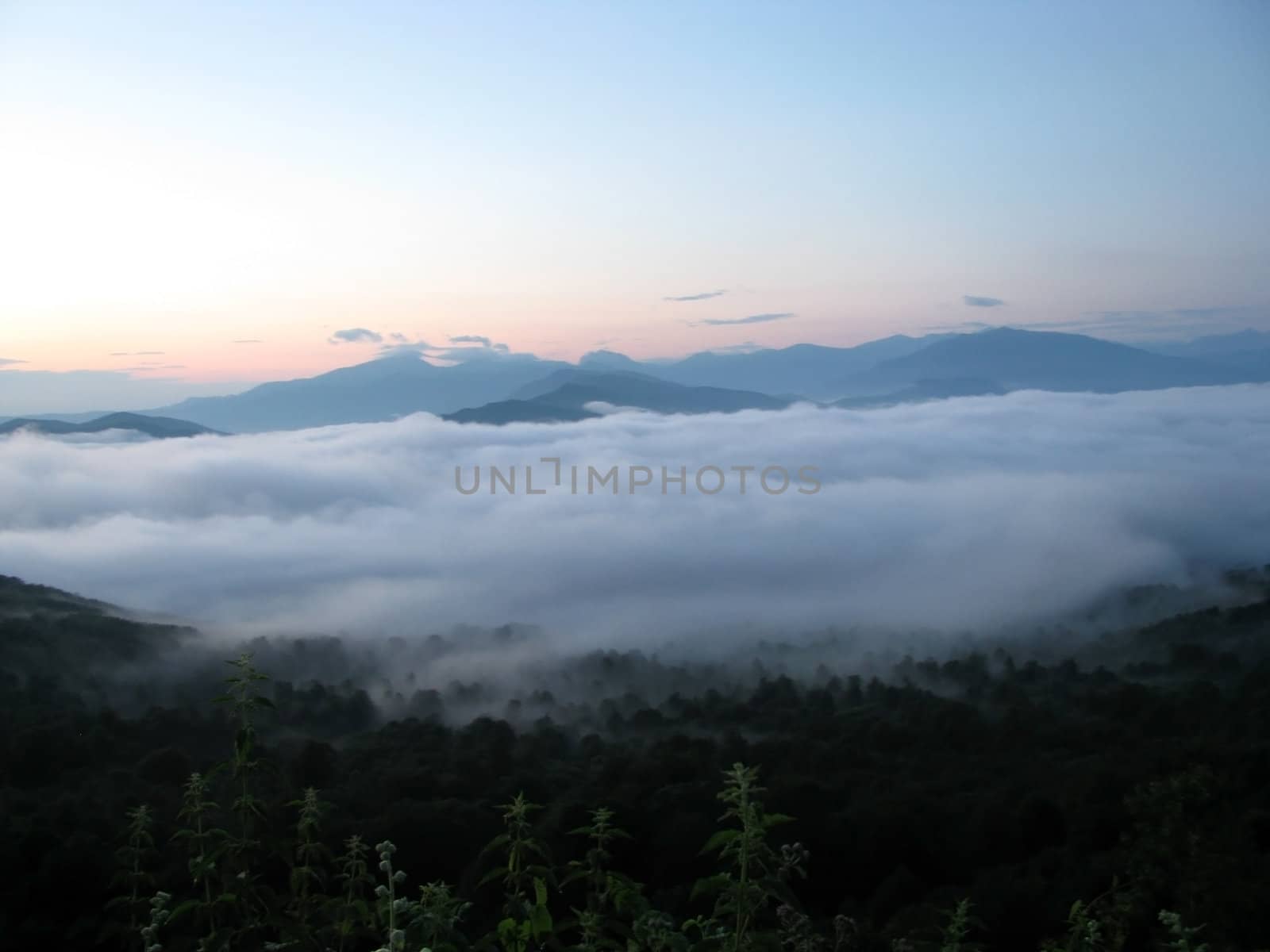 Mountains; rocks; a relief; a landscape; a hill; a panorama; Caucasus; top; a slope; clouds; the sky; a landscape