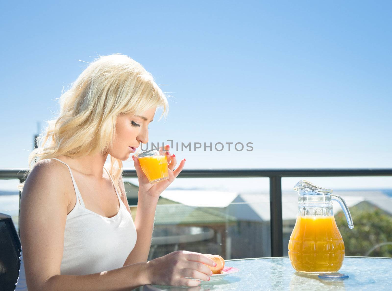 young woman having breakfast in a cafe
