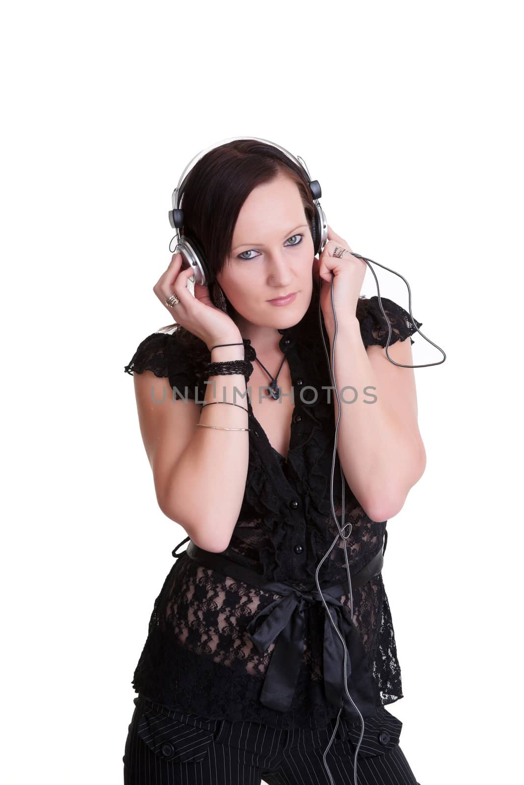 pretty young woman listening to headphones isolated on white