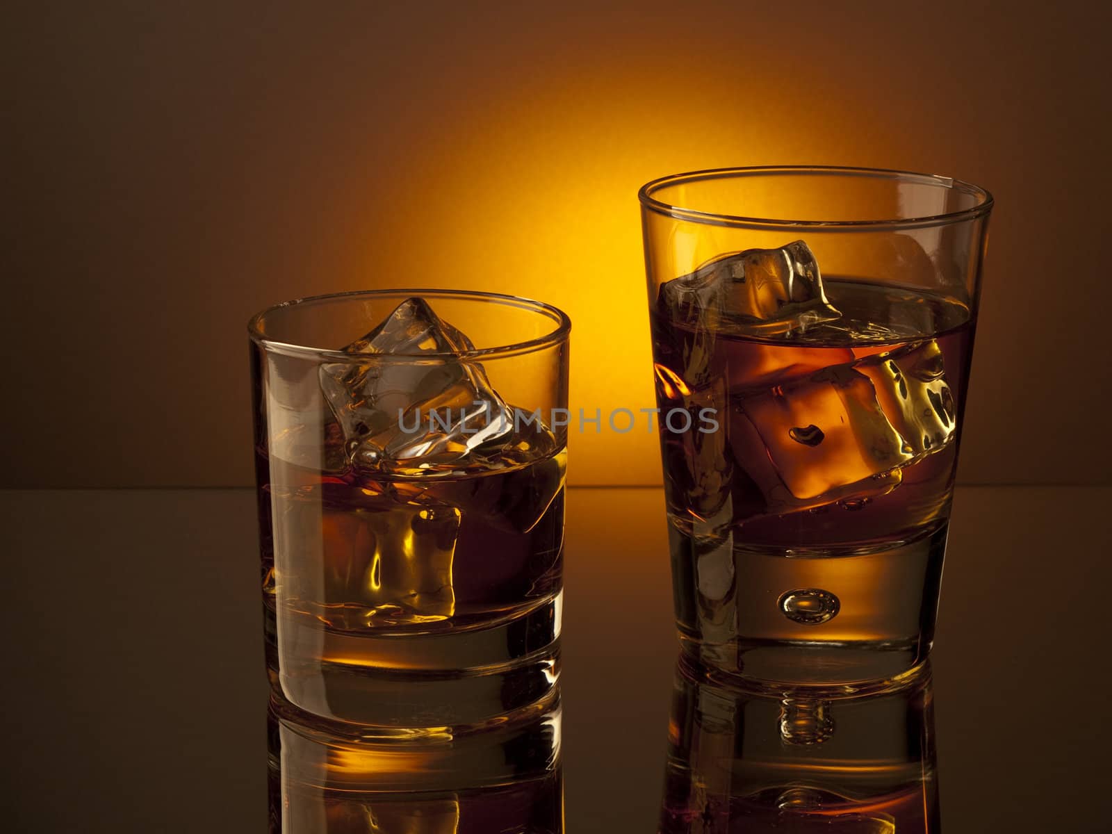 Two glasses of whiskey on the rocks