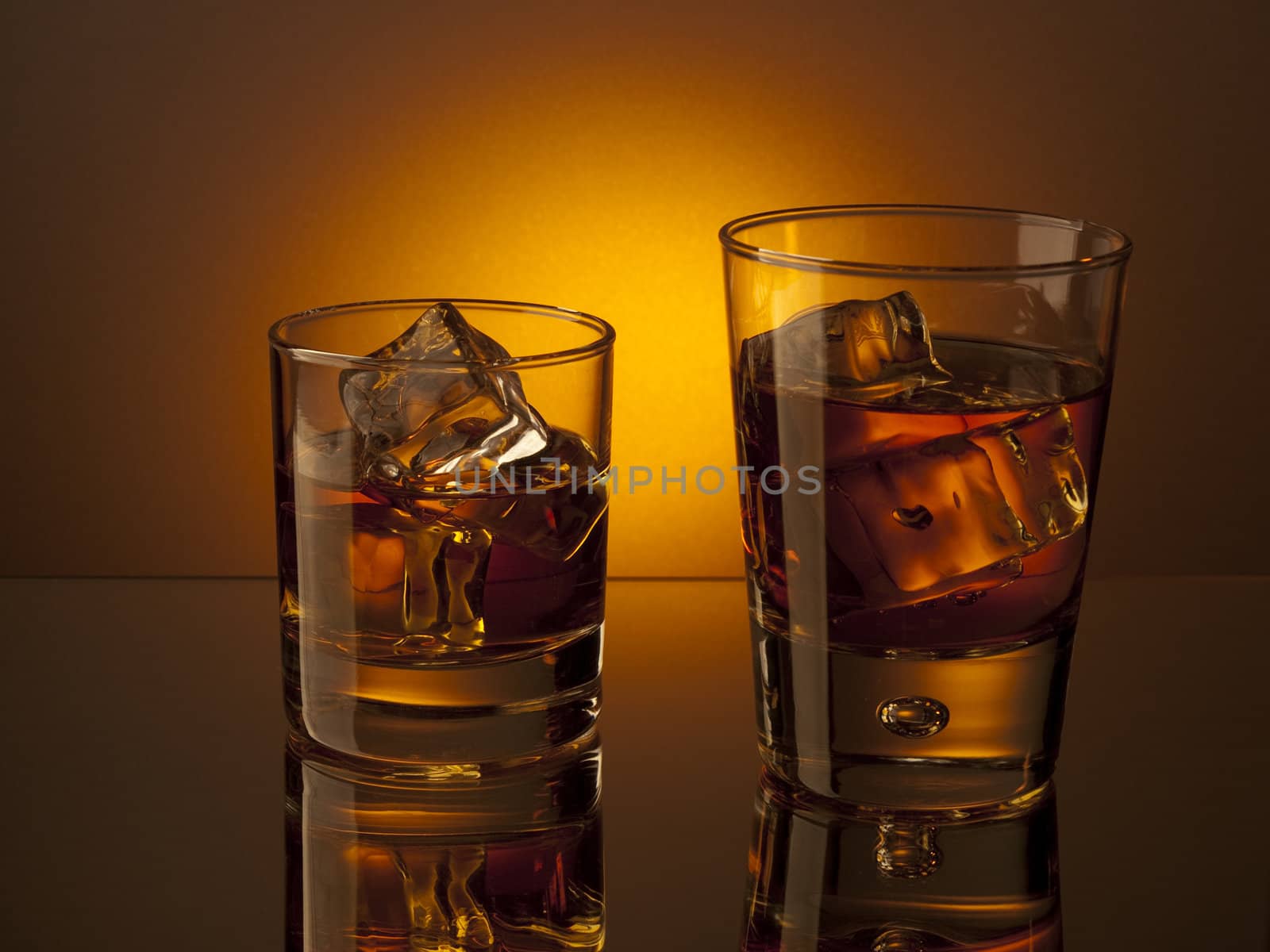 Two glasses of whiskey on the rocks