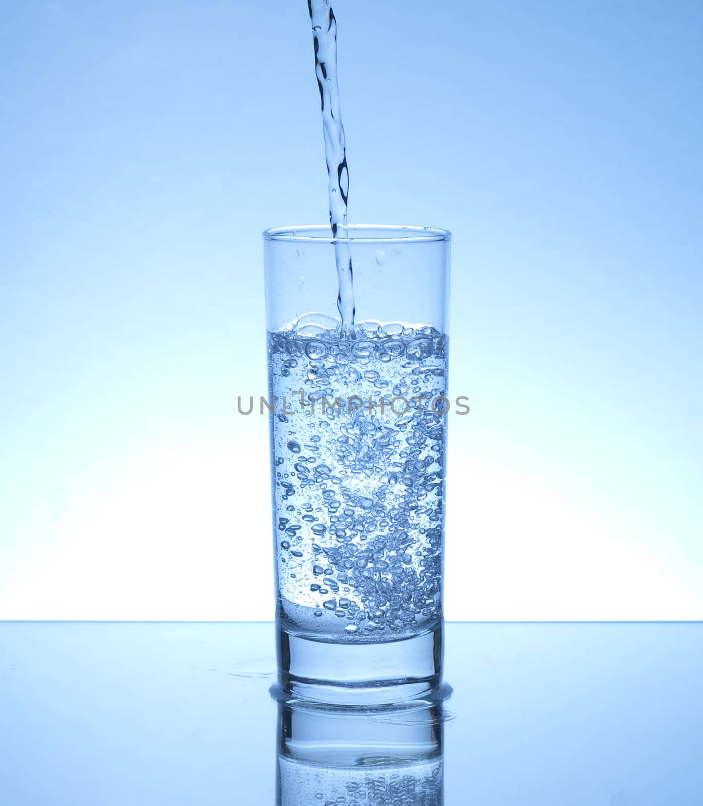 Water piring in a glass