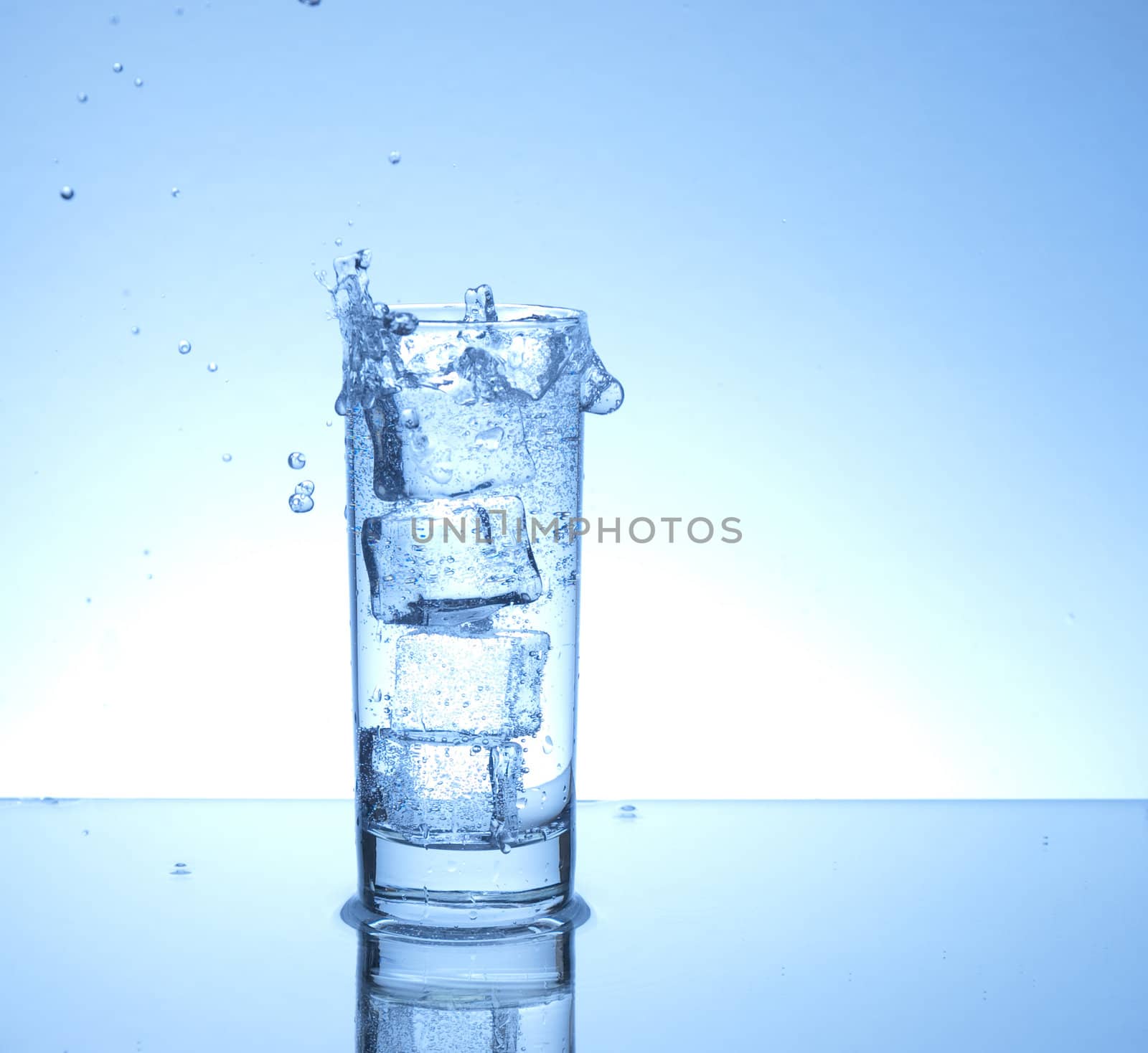 Four ice cubes in a glass