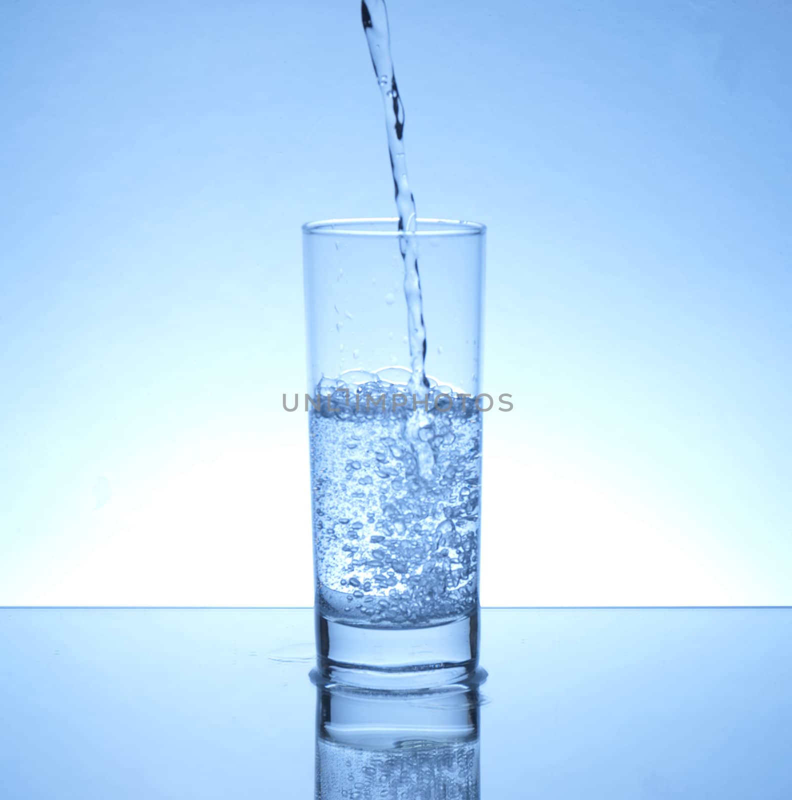 Water pouring in a glass