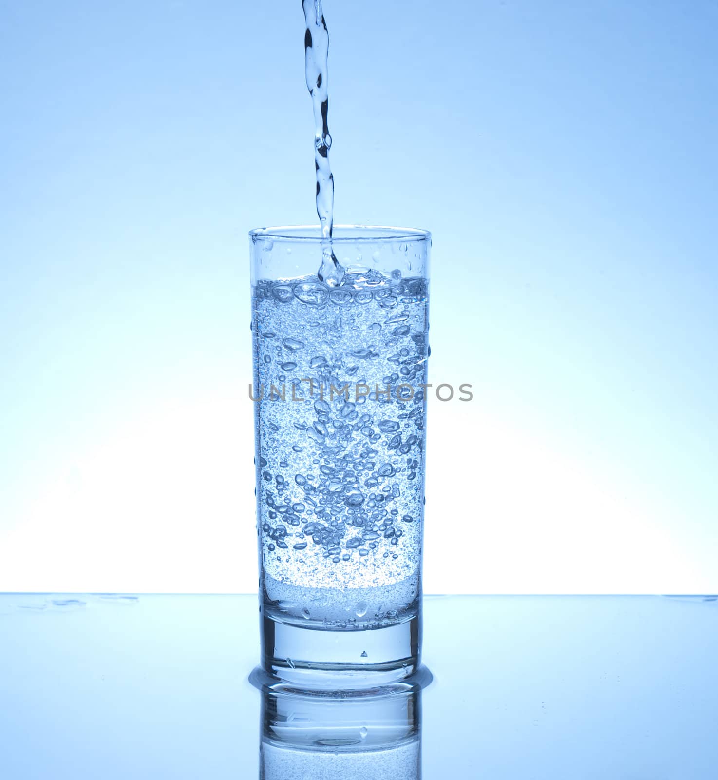 Water pouring in a glass 