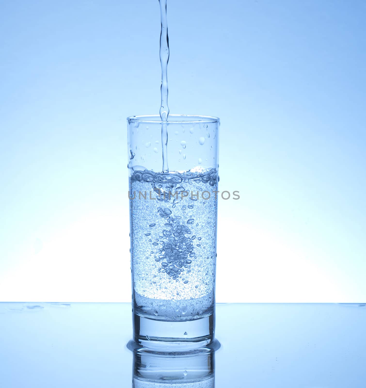 Water pouring in a glass