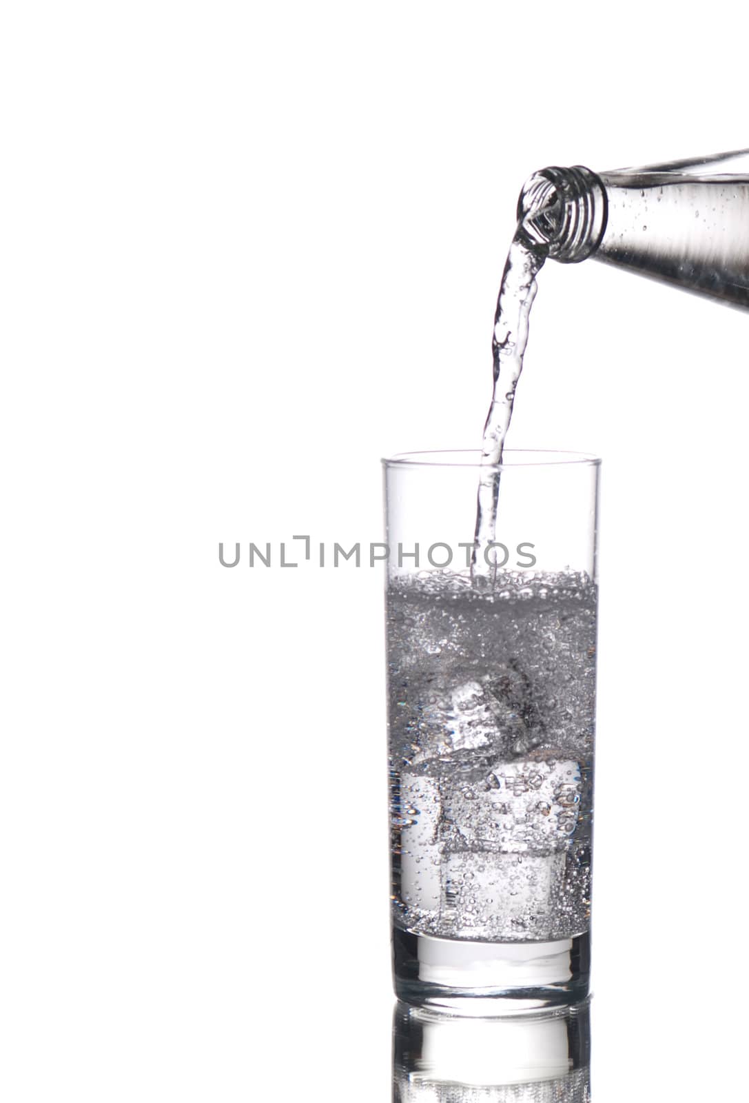 Sparkling water being poured in a glass