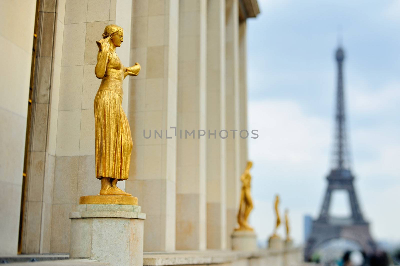 Statues in Trocadero area on background Eiffel tower in Paris