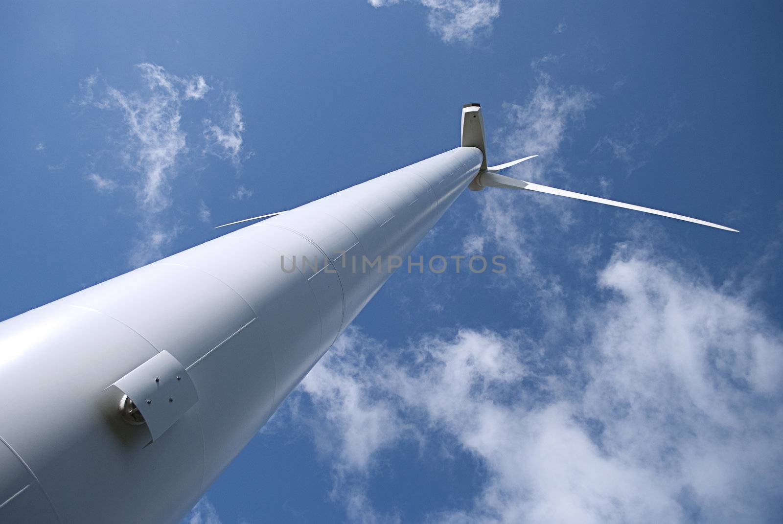 wind turbine under blue sky