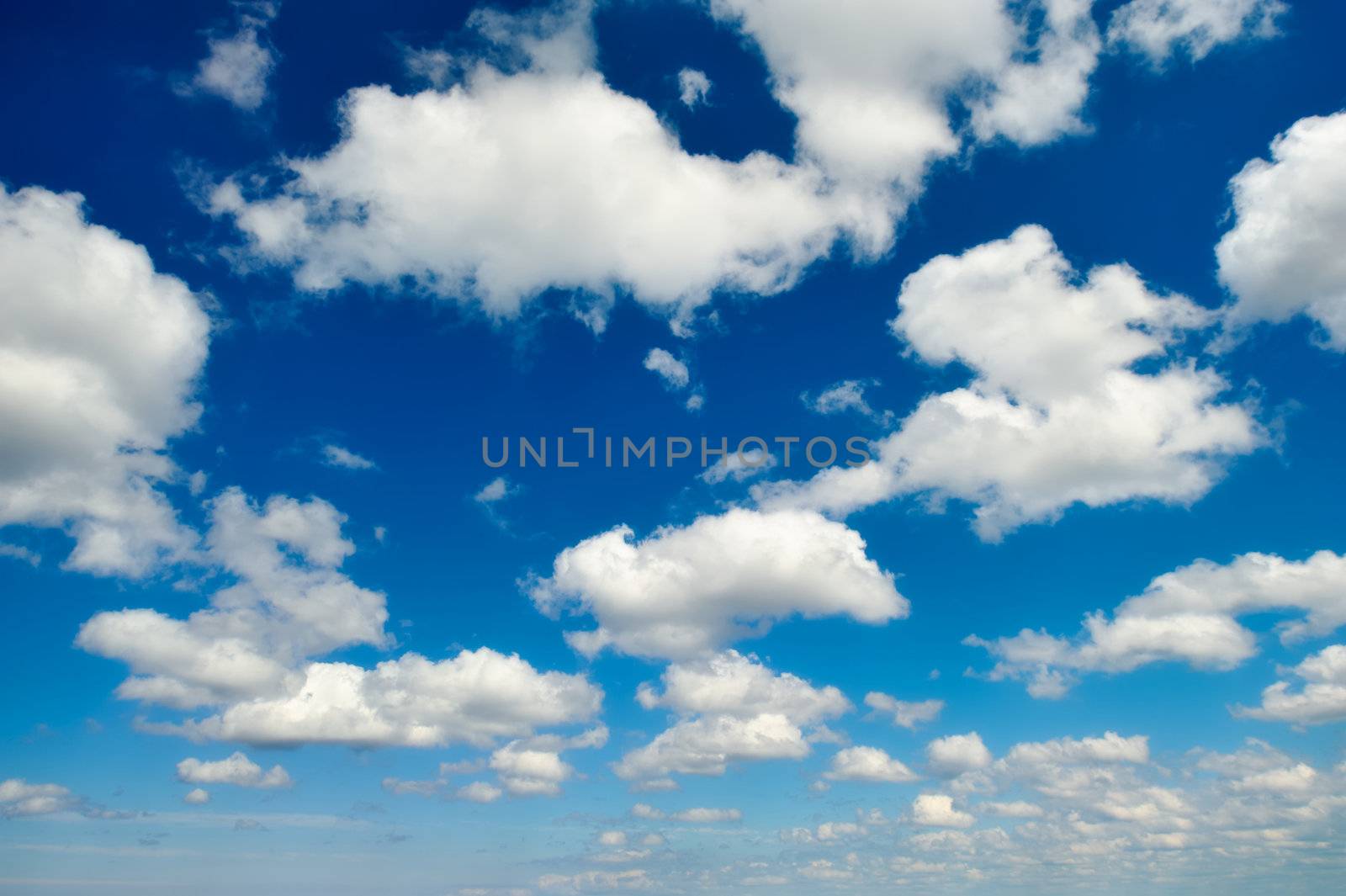 White clouds high in the blue sky