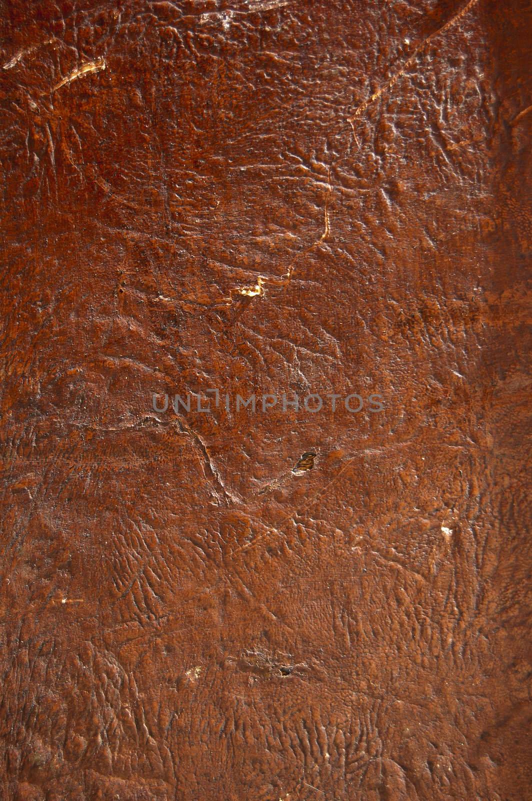 A close up of a brown raw leather