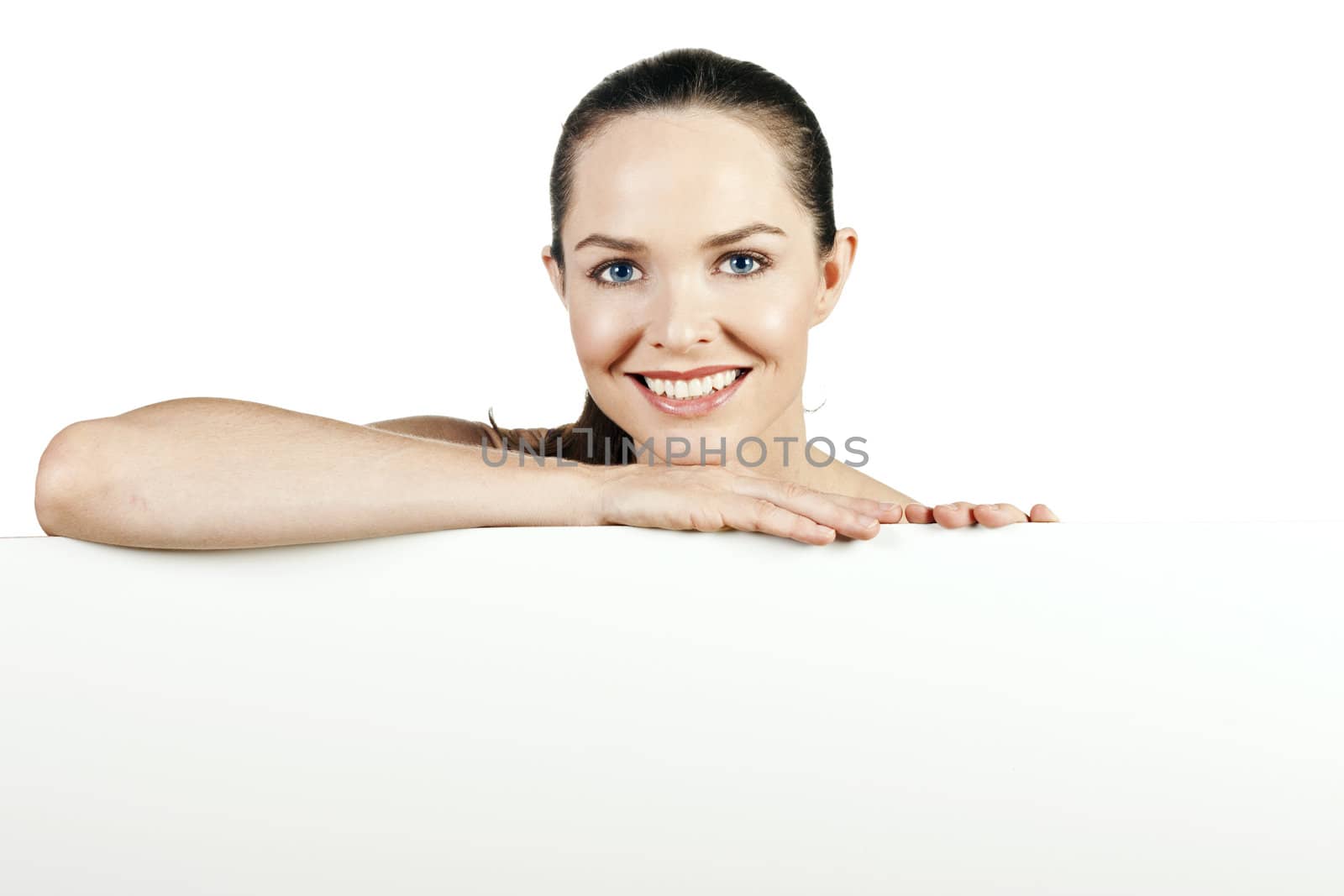 A portrait of a beautiful natural young woman smiling and looking at camera. 
