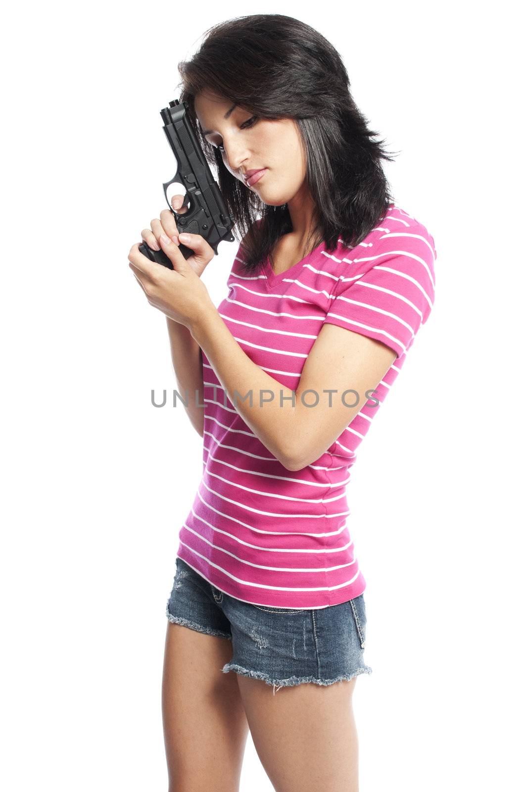 Attractive hispanic woman holding a hand gun on a white background