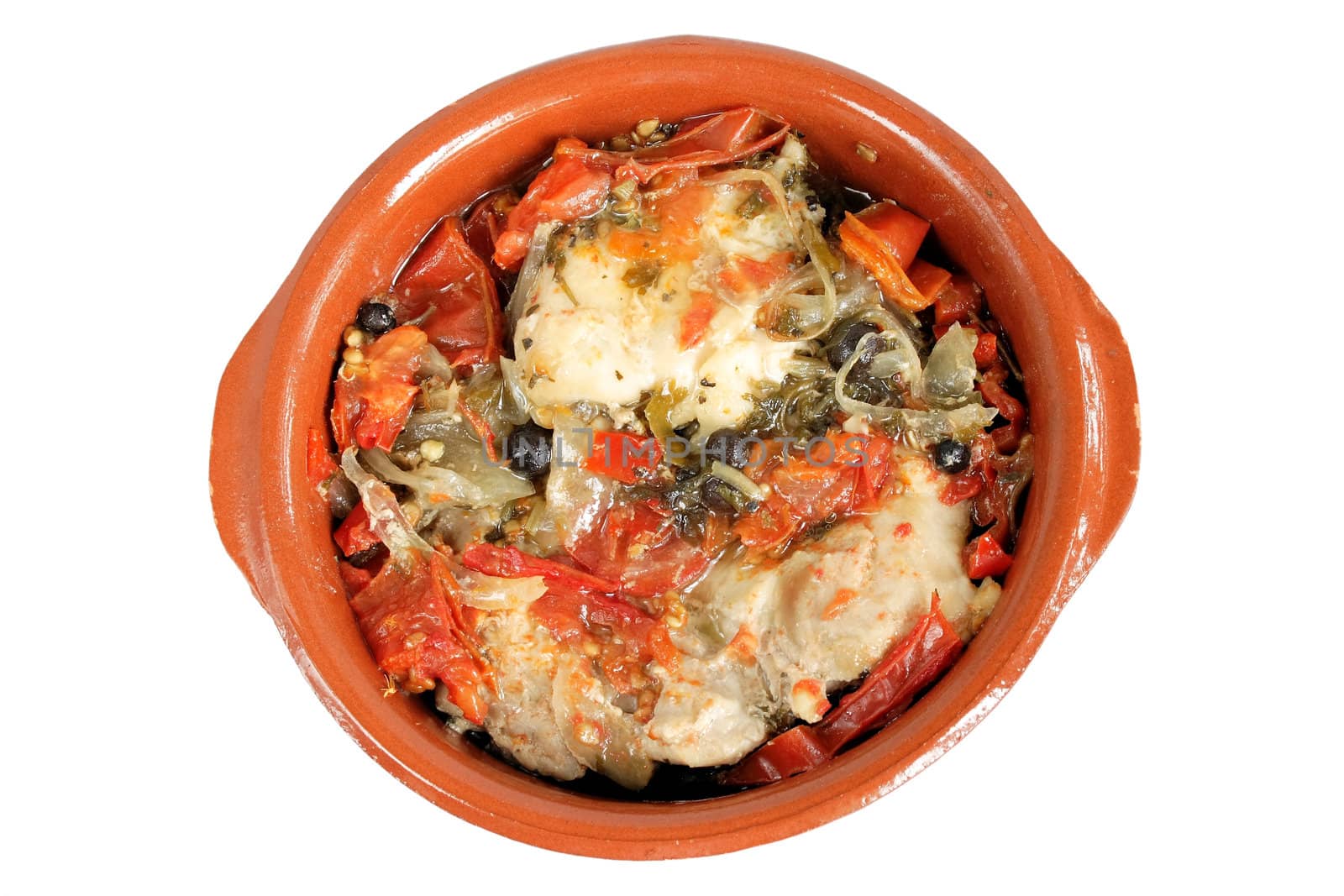 Stewed chicken and vegetables in ceramic bowl over whitee background