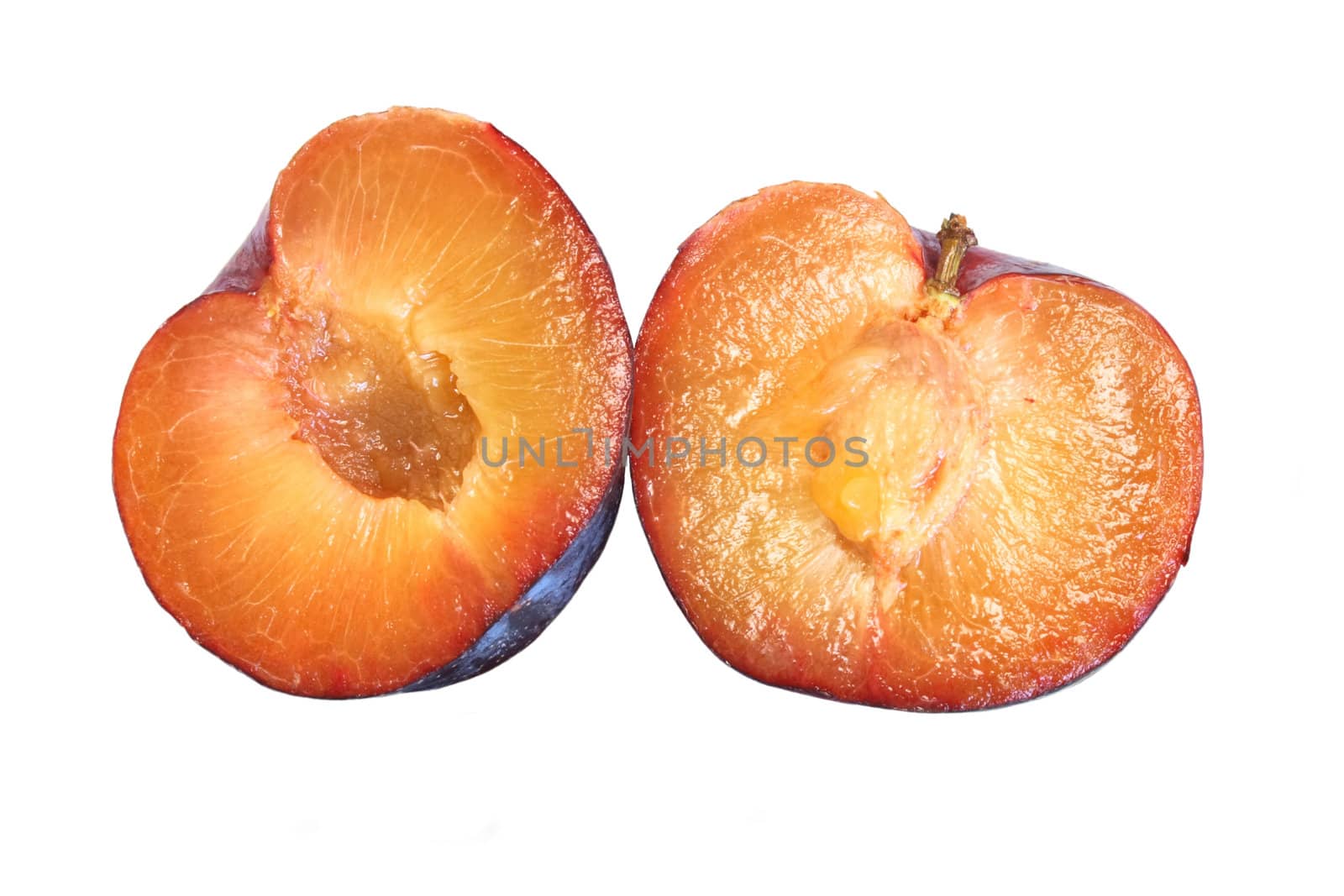 Ripe plums isolated over white background