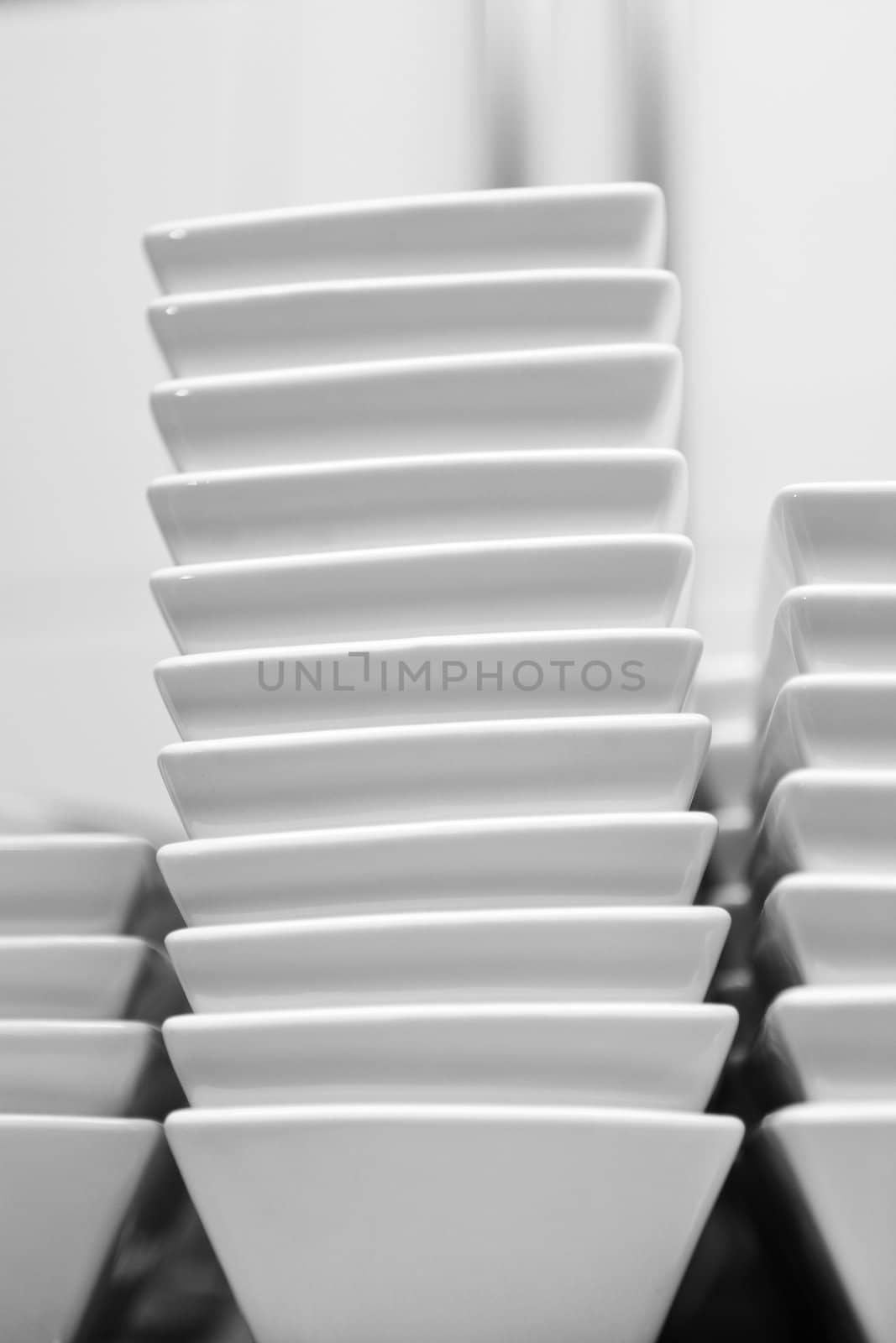 Black and white image of a stack of plates