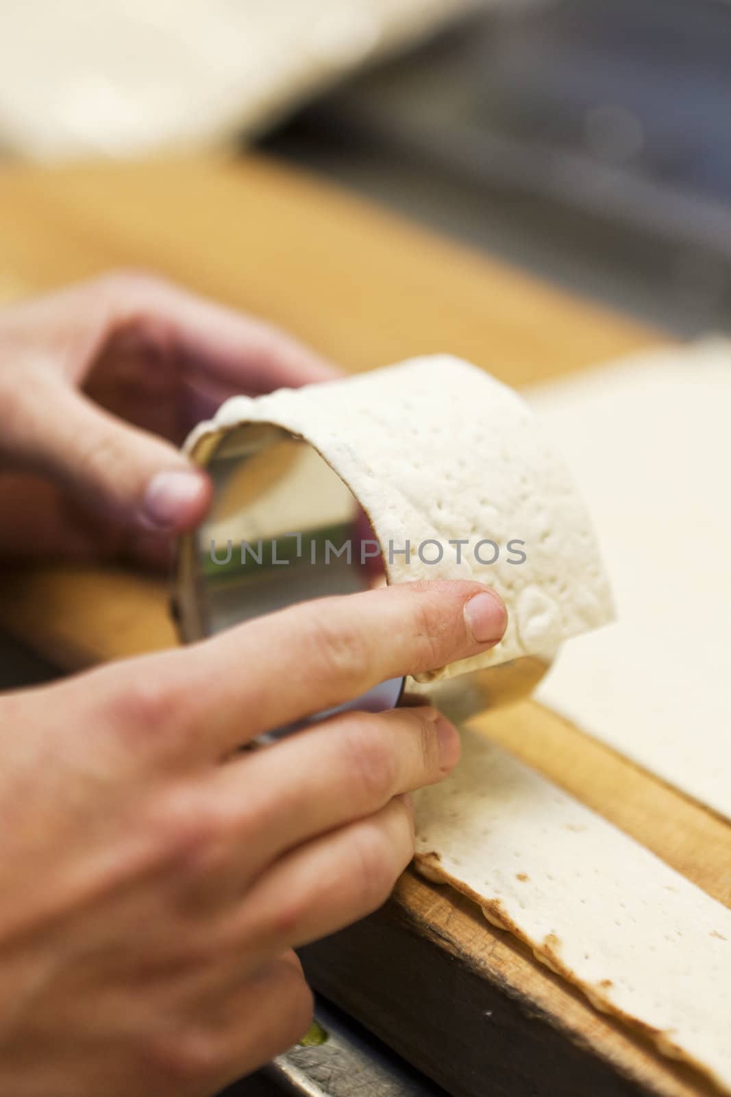 Close up of human hands preparing food