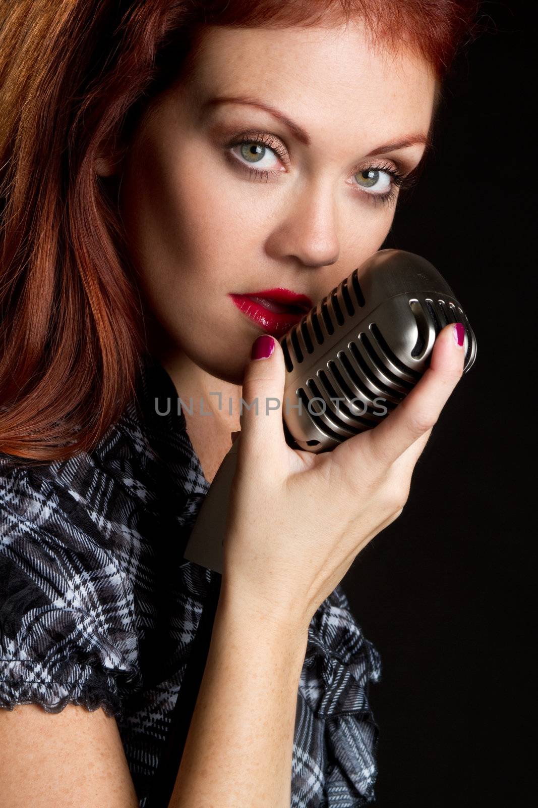Woman singer with vintage microphone