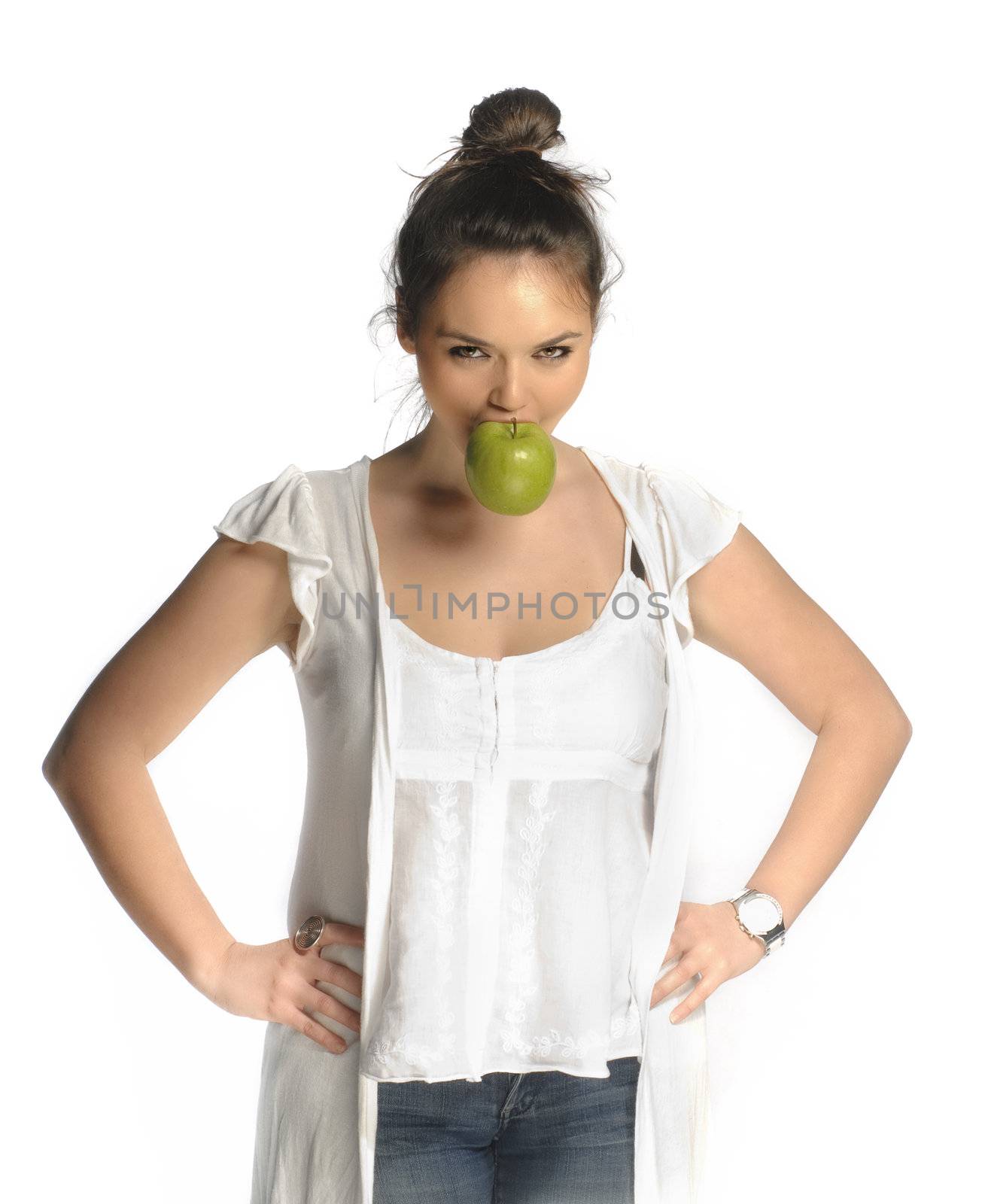 Beautiful young woman biting an apple portrait isolated on white