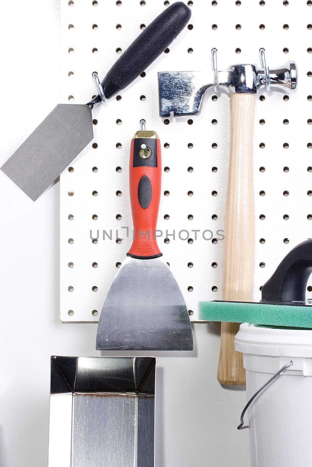 Different tools used for wall plastering and home improvement.