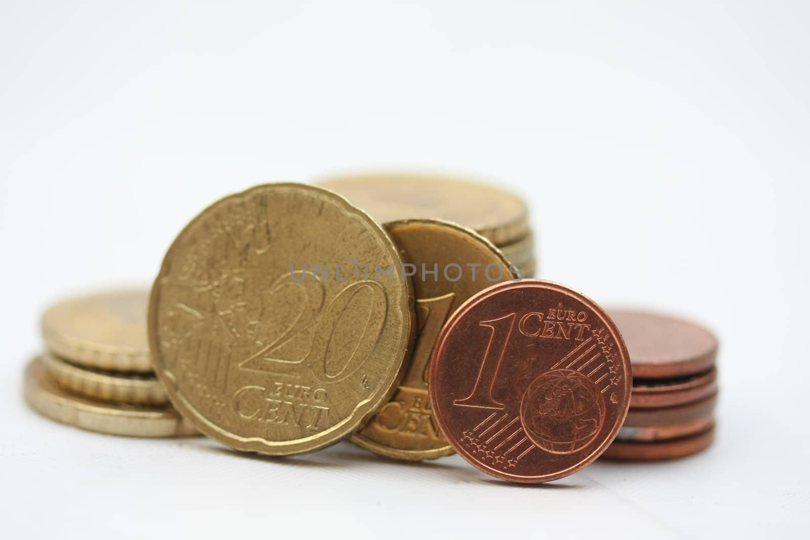 three euro coins making 2011 and a couple of other coins in the background. Perfect for 2011 greeting card