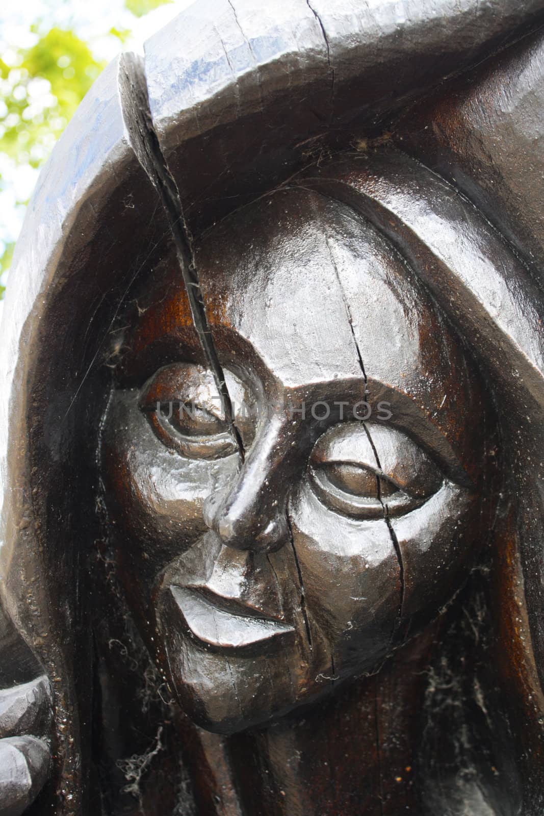 Wooden statue of face of a woman