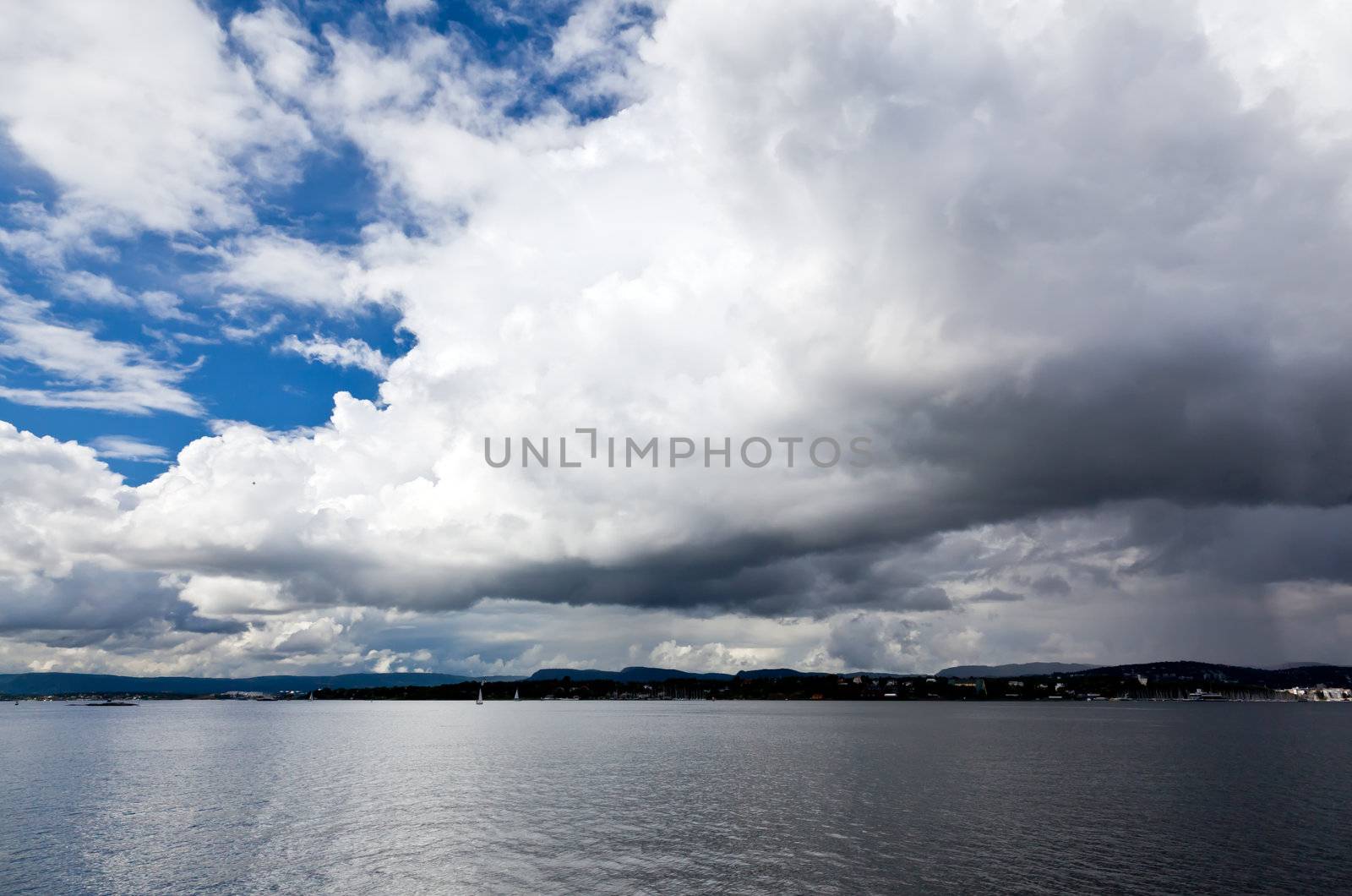 dramatic cloudscape in the harbor of Oslo by gary718