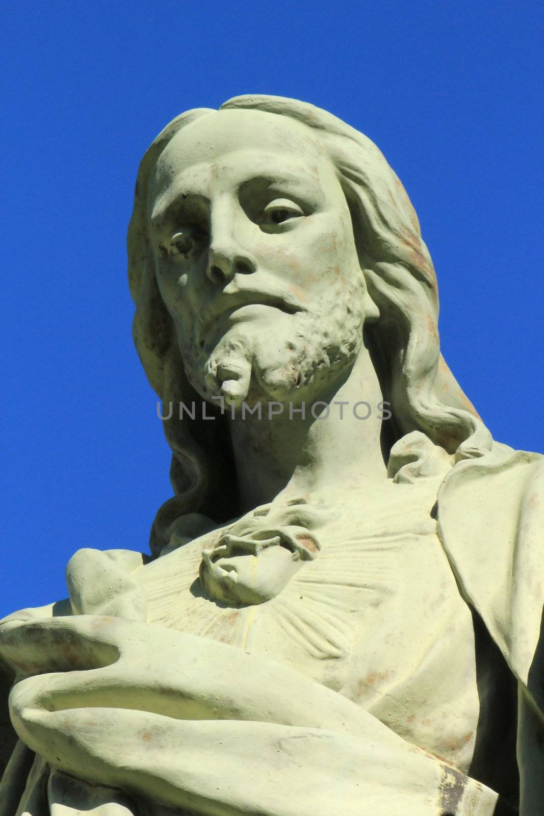 Close up of a white stone Jesus statue