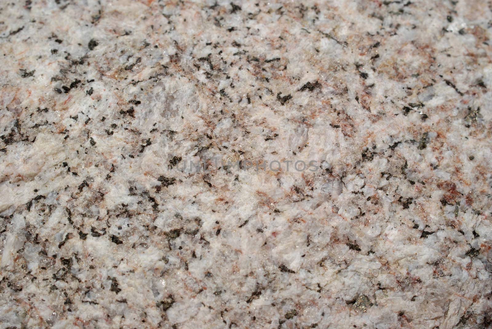 Granite Stone background close up. Shallow depth of field.