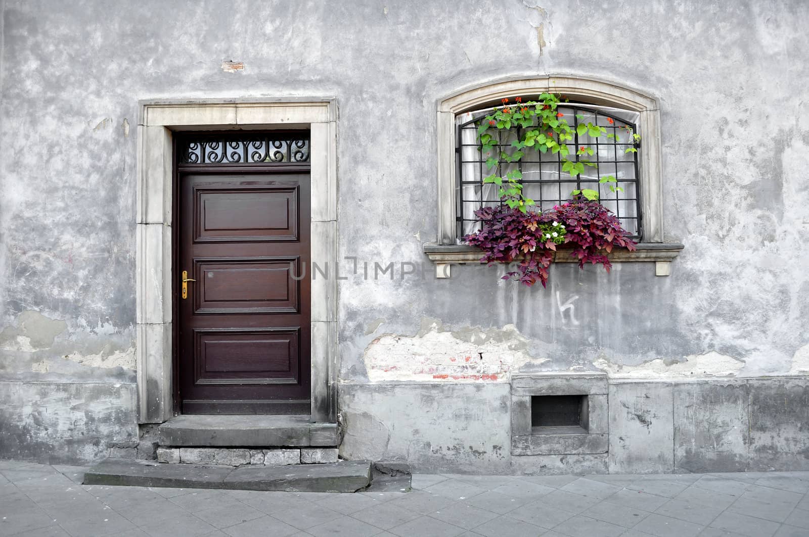 Simple old house facade in Warsaw, Poland.