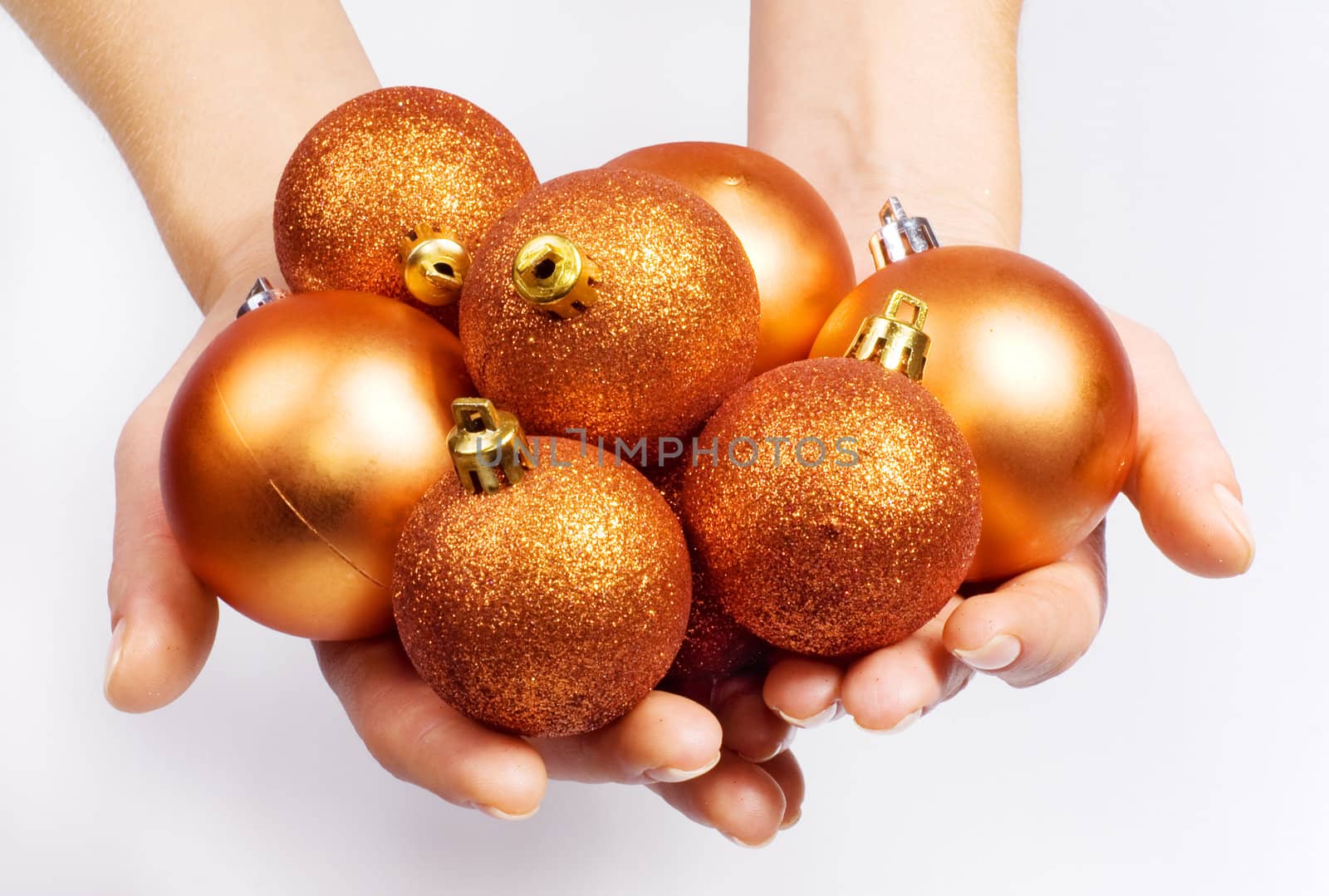 Female hands with Christmas spheres