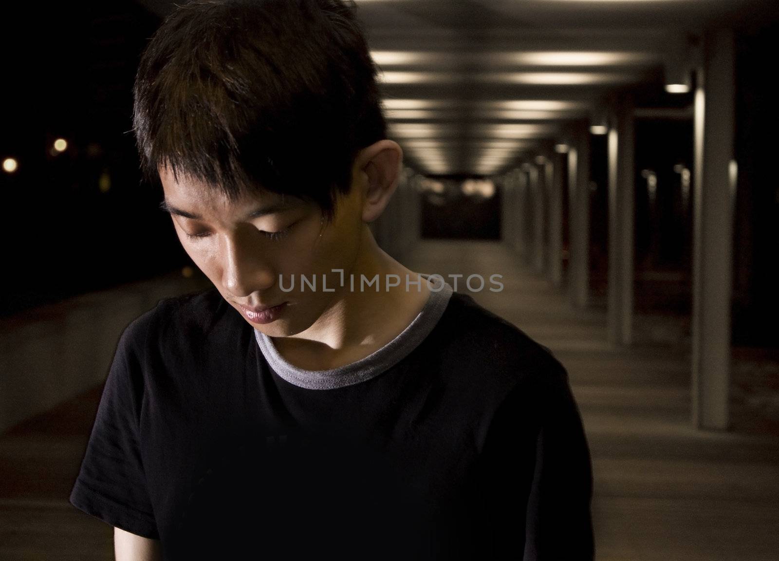 Portrait of an Asian man in the darkness for texture