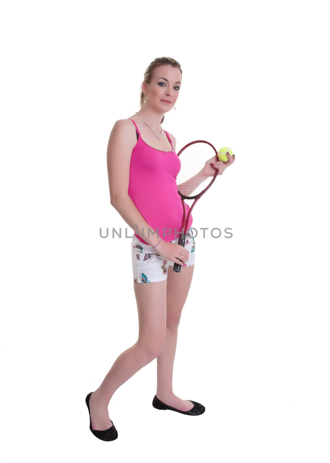 pretty young woman ready to play tennis isolated on white