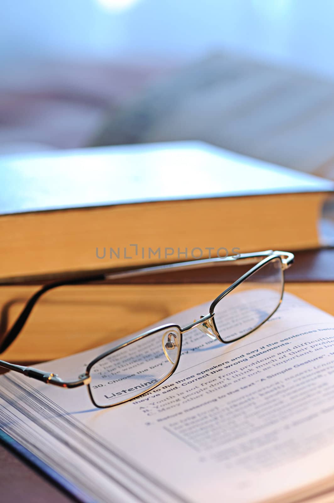 The combined glasses lay on the textbook