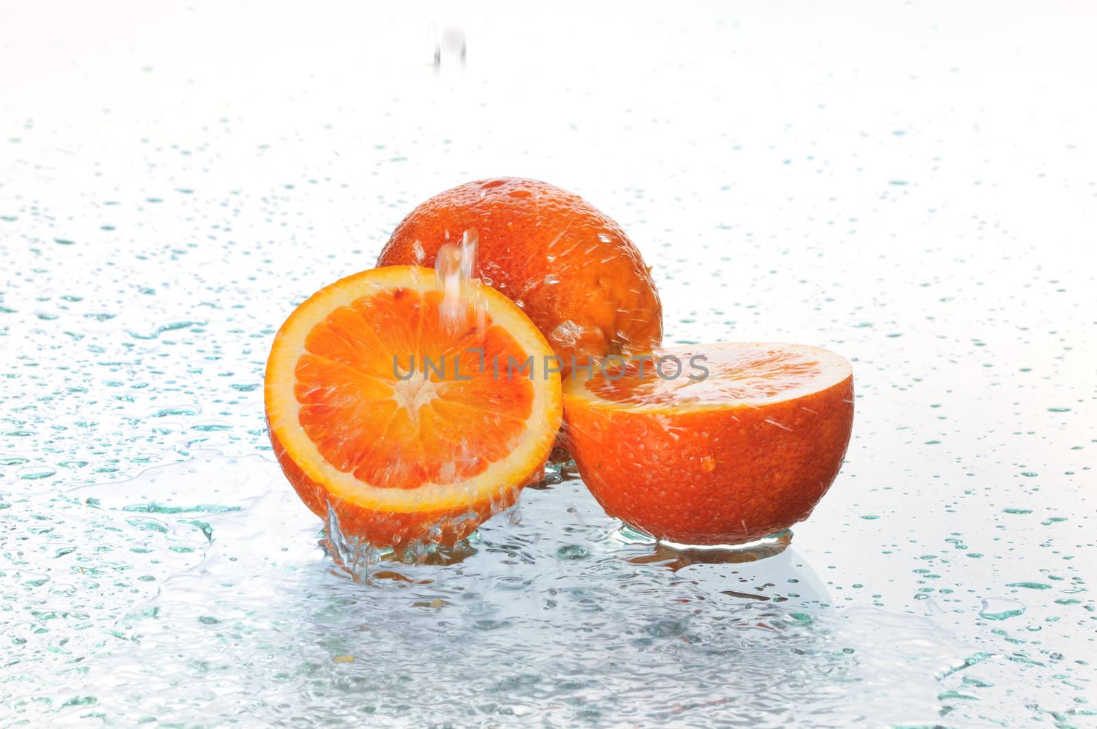 On a ripe orange pour water