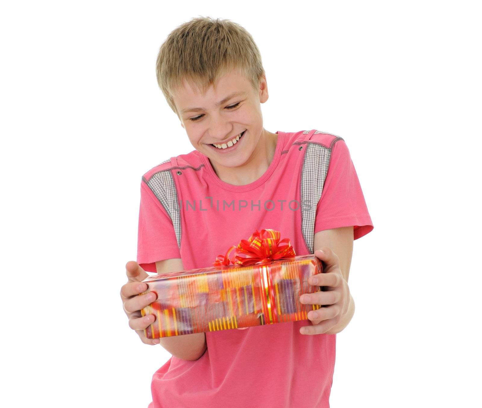 The joyful teenager with a gift isolated on white background