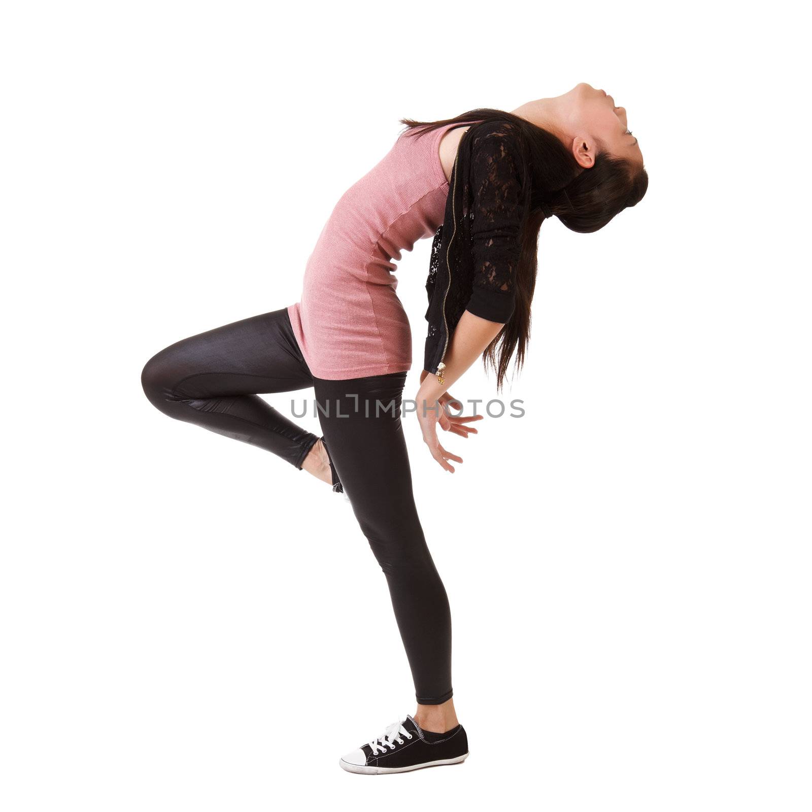 Stylish modern young woman dancing on studio white background.