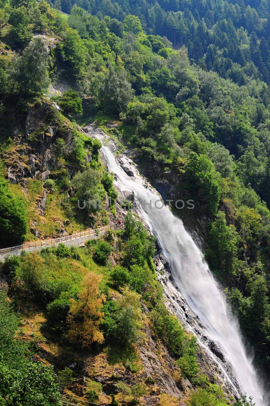 Big Waterfall With Rapids In The Italian Alps