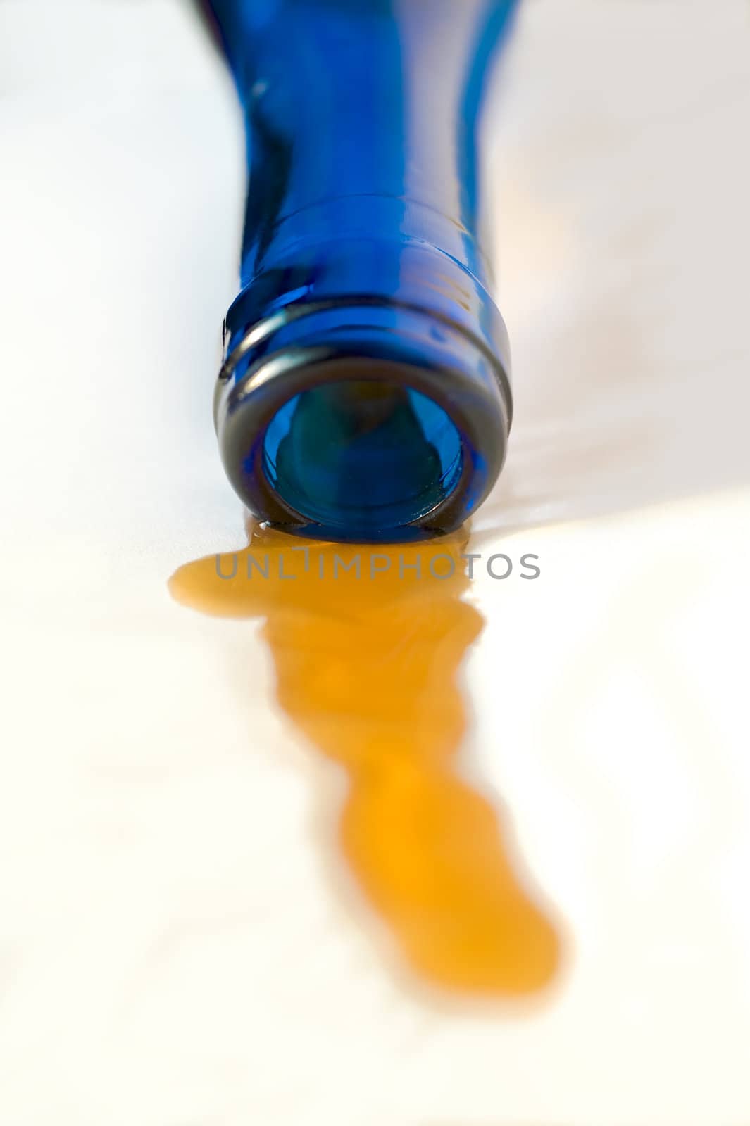  Part of a wine bottle from dark blue glass on a white background