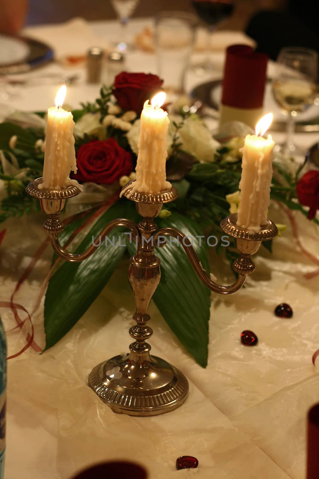 a candelabra at low light on a wedding table