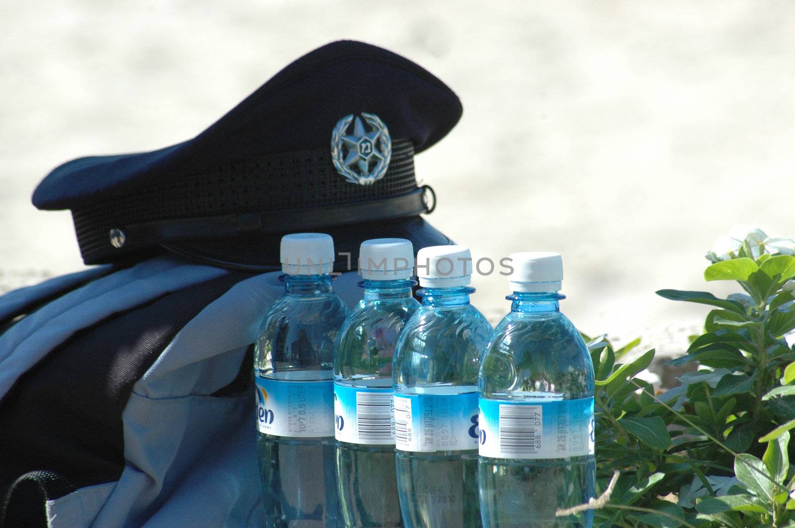 bottle with the water against the background of the police form
