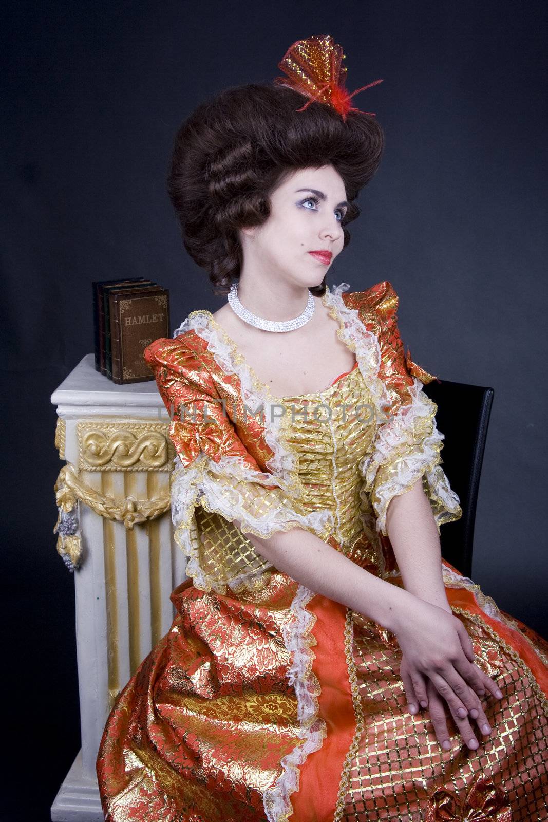 Elegant brunette from 18th century posing.