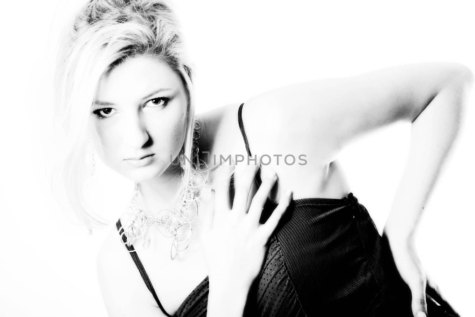 Young girl in a dress in the studio on a white background. 