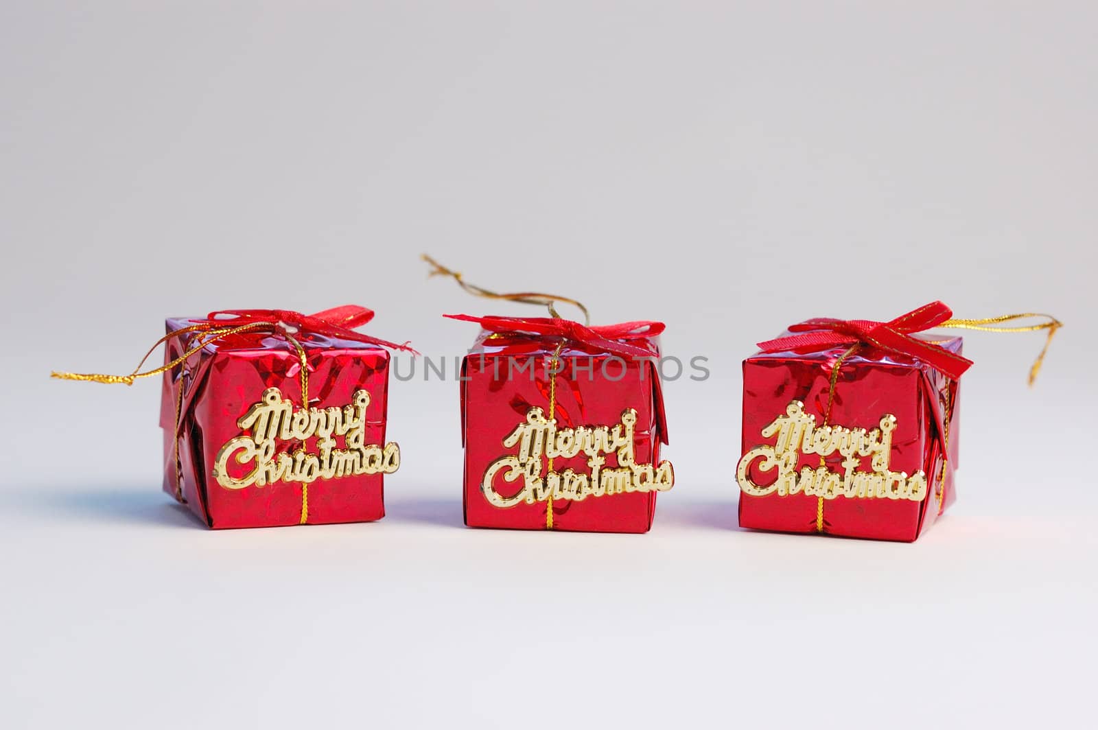 Red gifts on white background. Christmas decoration.