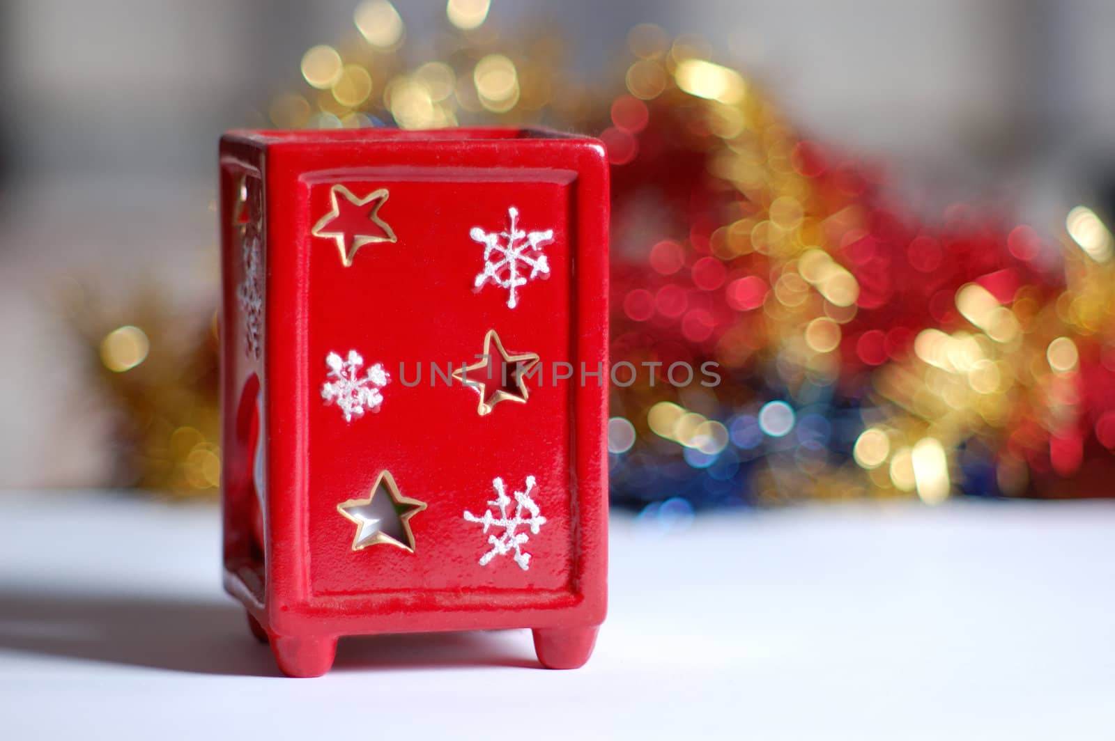 red christmas candle on color background