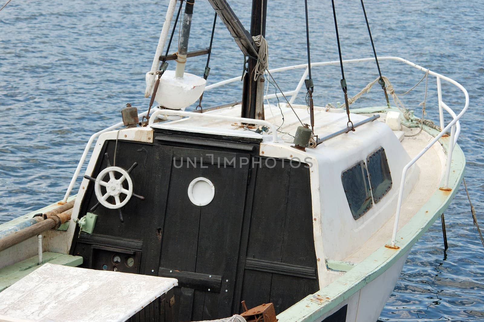 white fishing boa,  moored on the water